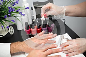 Manicure, Hands spa Cuticle oil. Beautiful man hands closeup. Manicured nails. Beauty hands. Beauty treatment