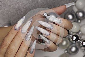 Manicure on long nails .