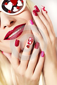Manicure and makeup with hearts.