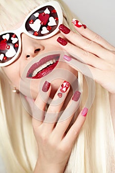 Manicure and makeup with hearts.