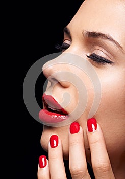 Manicure, makeup and woman with red lipstick and nails in a studio with a self care pamper treatment. Cosmetic, beauty