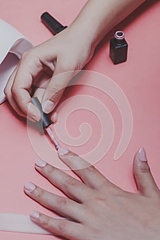Manicure procedure. Woman Nail Polish. Shellac finger nails