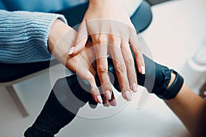 Manicure process female hands finger nails polish