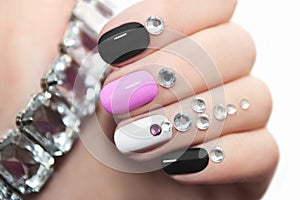 Manicure with rhinestones. photo