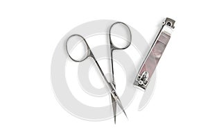 Manicure scissors and forceps isolated on white