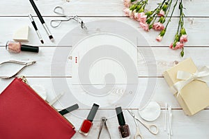 Manicure set and frame red composition of nails tools. top view