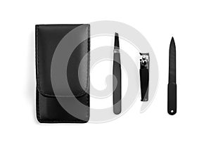 Manicure set. Nail clippers, nail file, tweezers, black leather case. On a white background