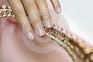 Manicure on short nails with rhinestones.
