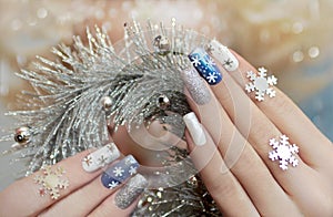 Manicure with snowflakes.