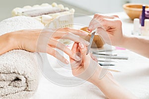 Manicure treatment at nail salon