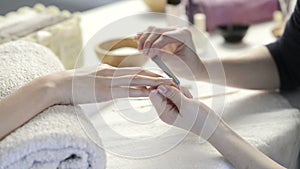 Manicure treatment at nail salon