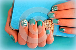 Manicure with turquoise varnish