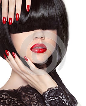 Manicured nails. Red lips. Black bob hairstyle. Brunette Girl