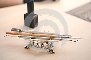 Manicurist`s hand tools on a beautiful decorative stand