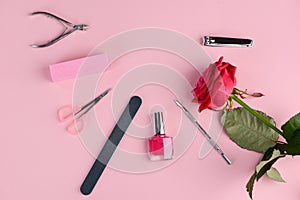 Manicurist tools and red rose