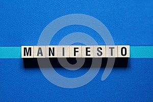 Manifesto word concept on cubes photo