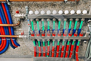 Manifold collector with pipes of underfloor heating system