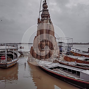 Manikarnika ghat in varanasi near to ganaga river with boats