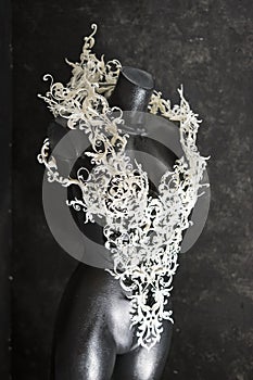 Manikin, Piece made with 3d printer, is composed of white flowers that form a corset, handmade, fantasy design Baroque style