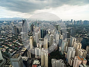 Manila Cityscape, Makati City with Business Buildings and Cloudy Sky. Philippines. Skyscrapers in Background.