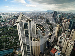 Manila Cityscape, Makati City with Business Buildings and Cloudy Sky. Philippines. Skyscrapers in Background.