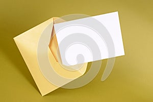 Manila envelope, blank message card or letter, close up, copy space
