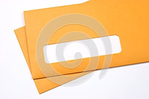 Manila envelopes over white photo