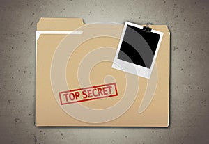 A manila folder with the faded words Top Secret on