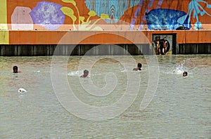 Manila, philippines, circa March 2023 - local kids swimming in pasig river