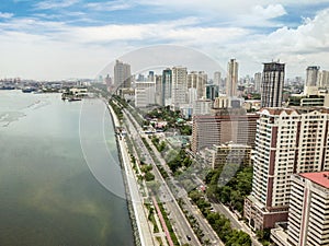 Manila, Philippines - Roxas Boulevard, Manila Skyline and Manila Bay. Tall residential condominiums line the famous photo