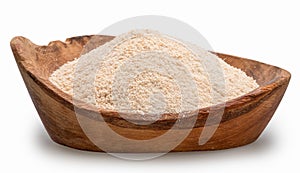 Manioc or cassava flour in wooden bowl on white background. File contains clipping path photo