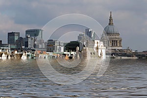 manipulated conceptual image of the city of london with historic buildings flooded due to global warming and rising sea levels