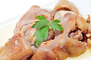 Manitas de cerdo, spanish stewed pigs trotters photo