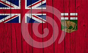 Manitoba Flag Over Wood Planks photo