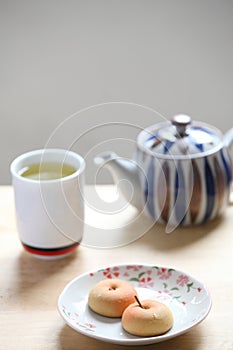 Manju with green tea photo