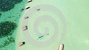 Manlawi Sandbar floating cottages in Caramoan Islands. A lagoon with floating crotches, top view.