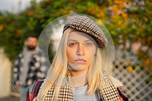 Manly world. Pretty woman in hat. Woman wear checkered clothes nature background. Girl wear kepi. Fall fashion accessory