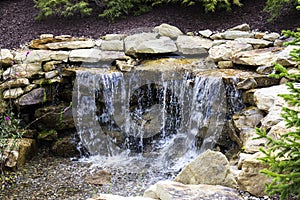 Manmade Waterfall with Fir Trees