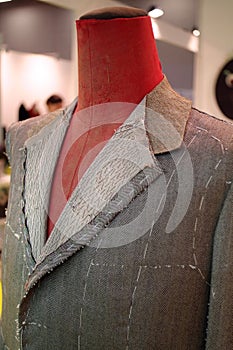 Mannequin with basted  jacket by a tailor