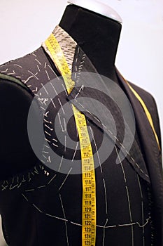 Mannequin with basted  jacket by a tailor