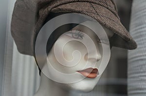 mannequin with brown hat in a women fashion shoppin