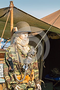 Mannequin dressed in military front of a tent