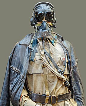 A mannequin dressed in military uniform with leather flying helmet, goggles, and oxygen mask.