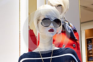 Mannequin face in black sunglasses and stylish clothing