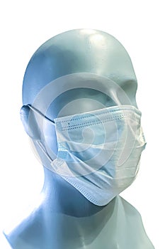 Mannequin head with protective medical mask isolated on a white background. COVID-19 protection concept