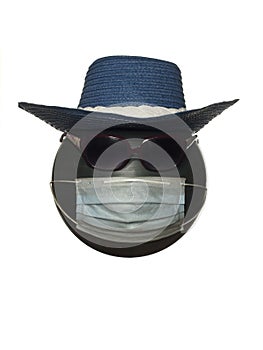 Mannequin head with sunglasses in a hat and in a protective mask isolated on a white background