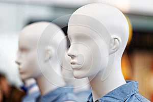 Mannequin heads against blurred background