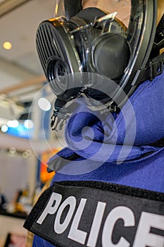 Mannequin in Police uniform and wearing safety mask