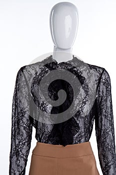 Mannequin portrait with black lace blouse.