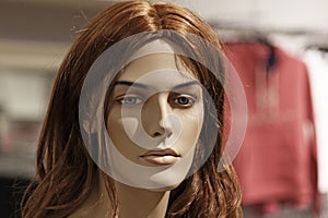 A mannequin with red hair and beautiful face